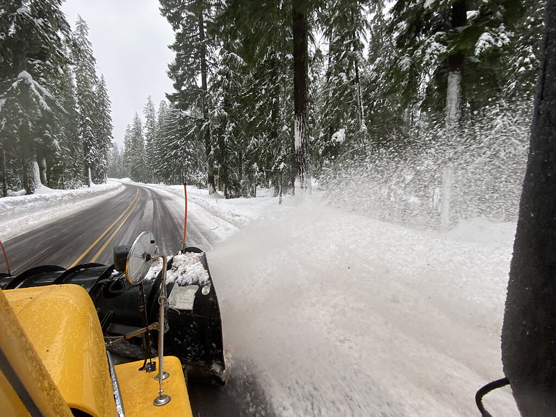 View from snowplow cab as it clears snow from road