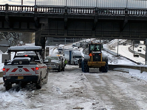 An ODOT Incident Response truck like the one at left responding to another Feb. 22-23 snowstorm location, was struck on I-205 Friday morning, Feb. 24.