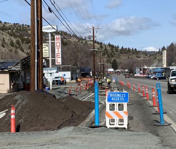 Business access signs along U.S. 395-C in John Day.