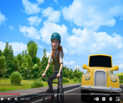 YouTube video of person riding bicycle with yellow vehicle approaching and blue skies.