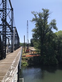 Construction image showing river and crane at Van Buren Bridge