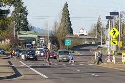 photo of people crossing in crosswalk