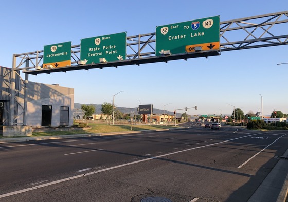 Traffic signs over the Big X intersection in Medford