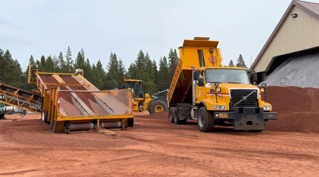 Maintenance equipment moves cinders at maintenance yard