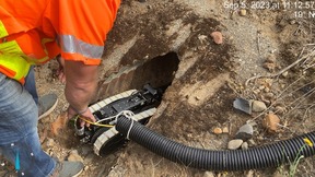 ODOT crews guide a camera into a culvert under U.S. 30 to assess conditions.