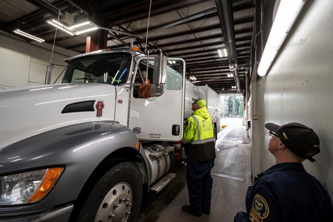 CCD staff sharing human tracking awareness materials with a truck driver on January 11, 2024.