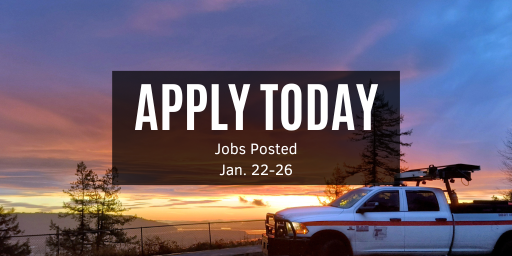 Incident response parked during a vibrant purple/pink sun setting that is distance.