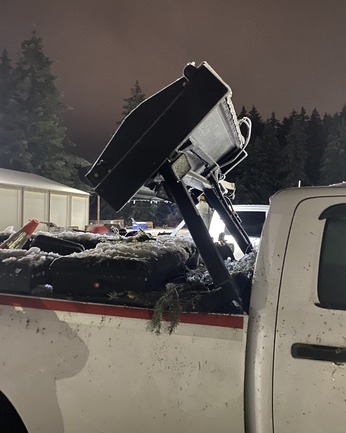 Jensen's work truck damage after a tree fell on it while working on U.S. 126W.