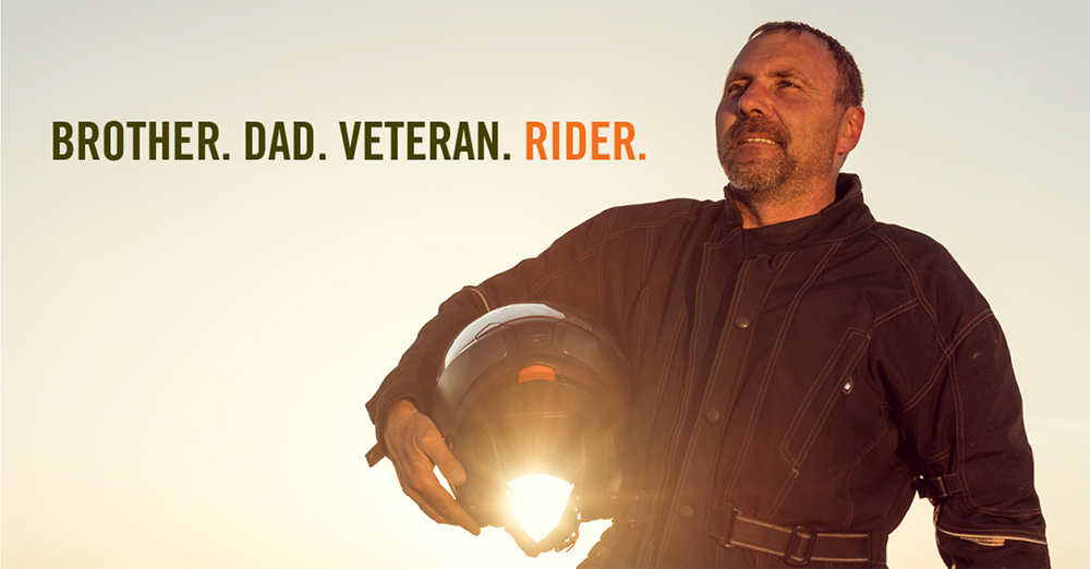 Brother. Dad. Veteran. Rider. Image of man holding a motorcycle helmet under his arm.