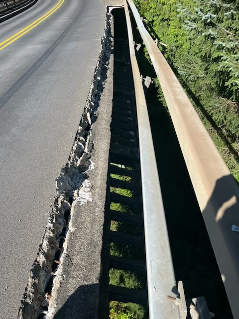 Section of concrete sidewalk and guardrail damaged on U.S. 101 bridge 4 miles north of Manzanita on Aug. 29, 2024.