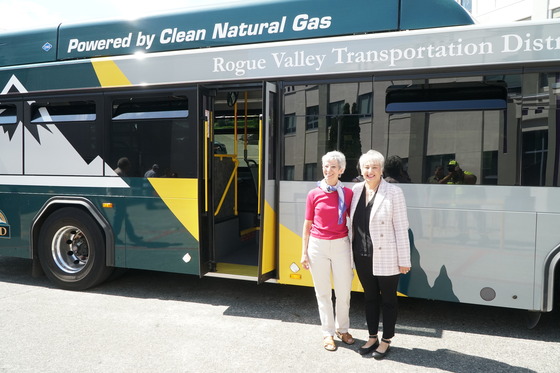 Representative Nancy Nathanson and Rogue Valley Transit District General Manager Julie Brown stand outside bus