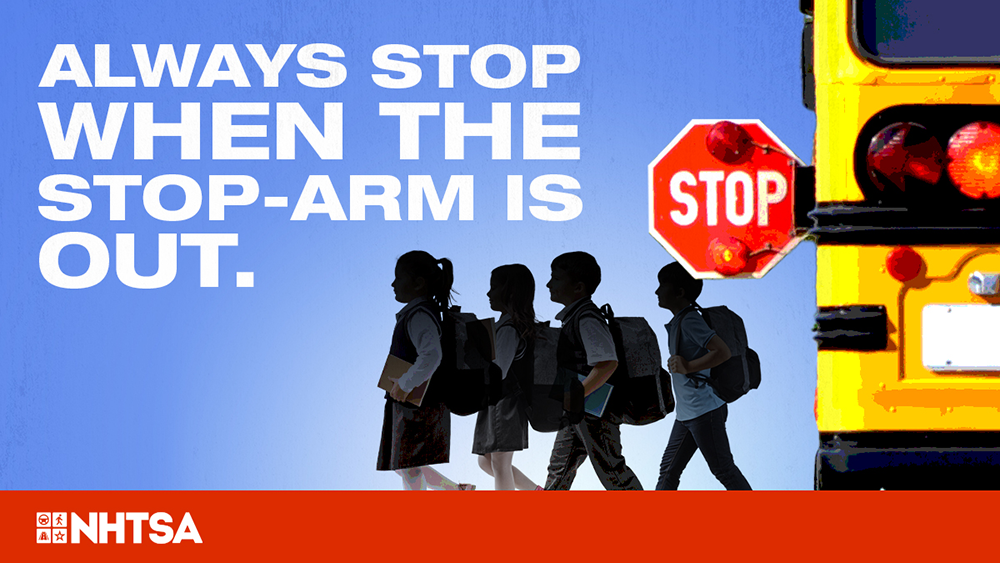 Always stop when the stop arm is out. School bus with stop arm and children crossing.