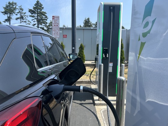 EV charges at a public DC fast charger