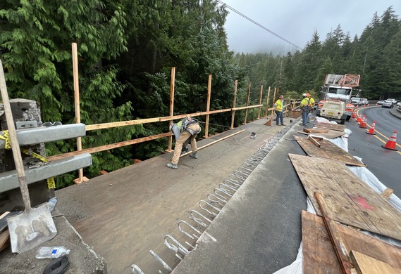 Photo of workers making repairs on Necarney Creek Bridge