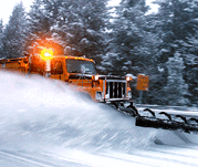 Winter snow plow moving snow