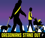 Oregonians Stand Out. Big foot and person walking with a stroller are visible with retroreflective clothing.