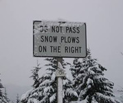 Sign: Do not pass snowplows on the right