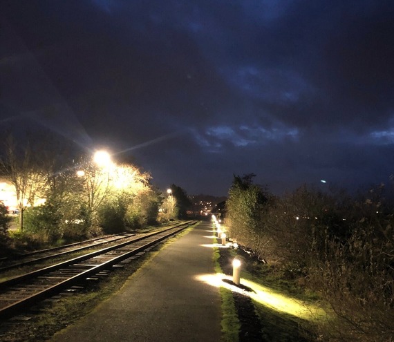 Photo of one of the new lights along the Astoria Riverwalk Trail at night