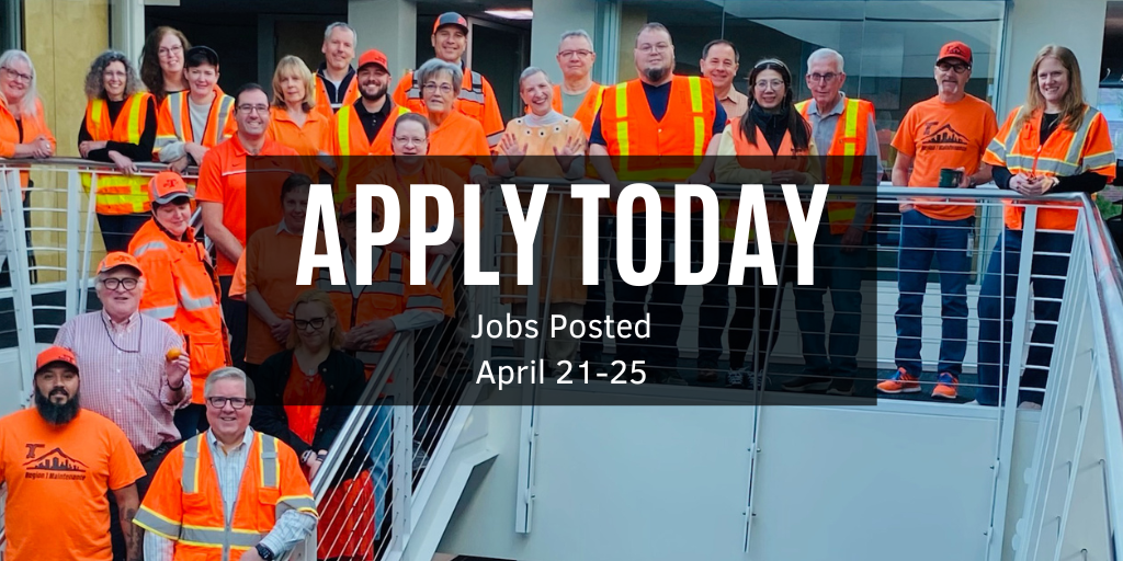 Photo of Oregon Department of Transportation Employees standing on a staircase in orange clothes. 