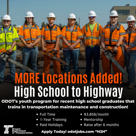 Trainee's standing for a photo with equipment 