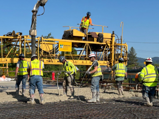 Photo showing crew pouring concrete for the Van Buren Bridge project