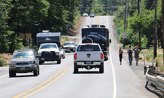 Vehicles and pedestrians on a two-lane highway