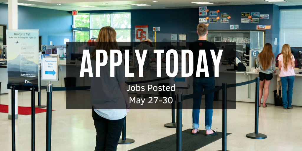 Customers standing in line at a DMV office. 