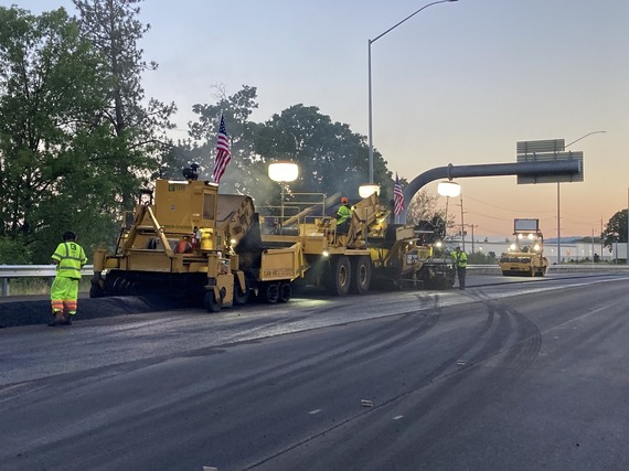 Crews working on the final pavement on OR 217