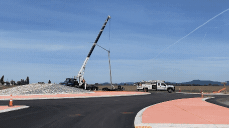 Gif of four photos showing Clow Corner Road roundabout progress fading into each other.