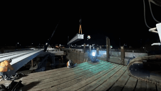 Gif showing footage of beams being sent for the new I-5 at the Aurora-Donald interchange