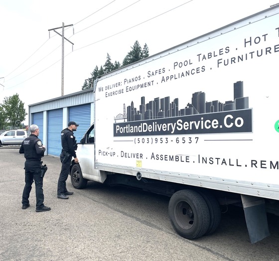 Law enforcement approaches a household goods truck