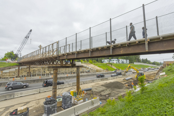 Pedestrians crossing the temporary bridge