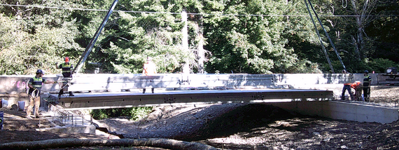 Photo showing beams being set on the new bridge