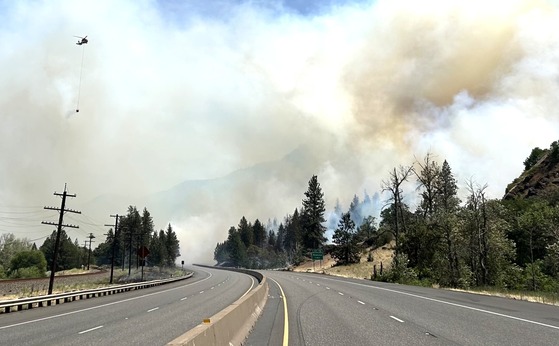 Smoke from the Rowena Fire billows over Interstate 84 on June 11.