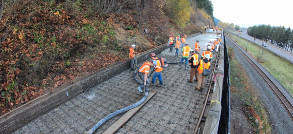 View of the east viaduct after crews installed new rebar and started pouring the new concrete road surface.