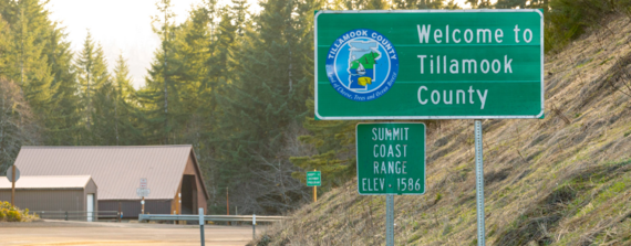 Photo showing a "Welcome to Tillamook County" sign along OR 6