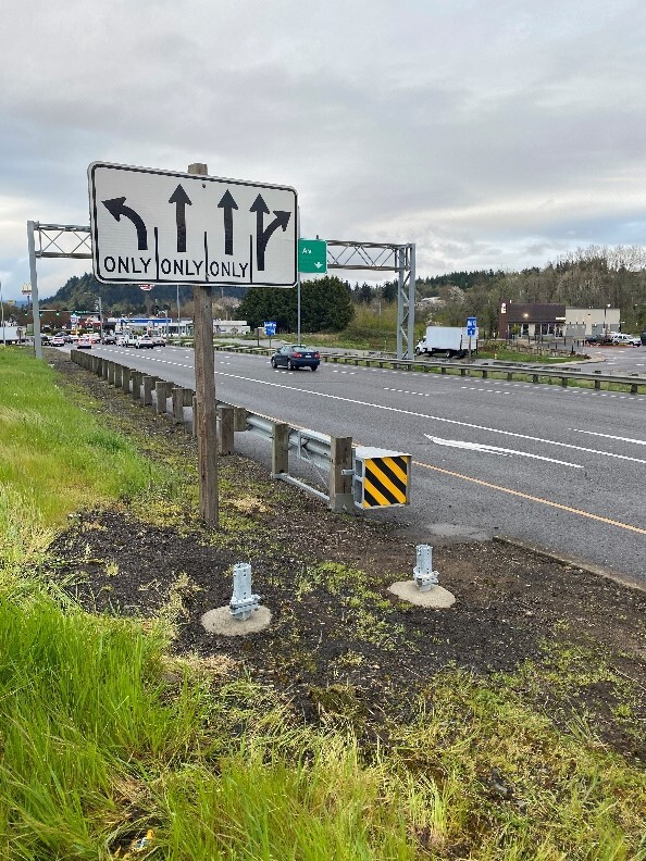 View of the new base pole foundations that will be replaced with upgraded signs on I-84 at the Marine Drive ramp interchange.