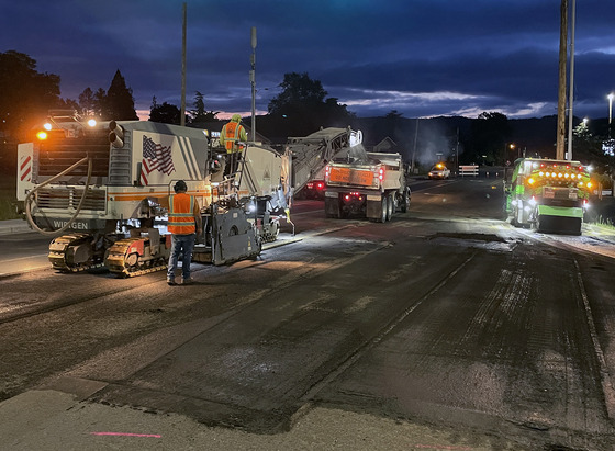 Workers pave local road approach