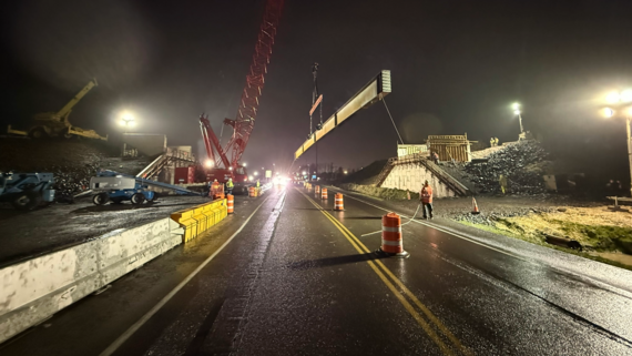 Photo showing the beam being set for the new overpass