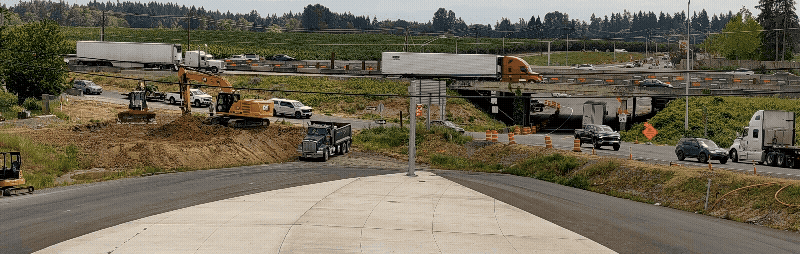 Construction equipment moving material in the work zone gif