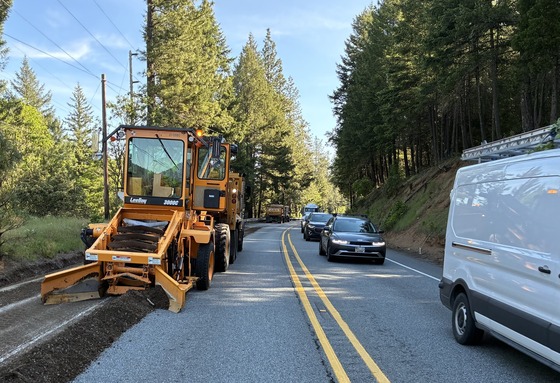 A grader works on shoulders and ditches along U.S. 199. 