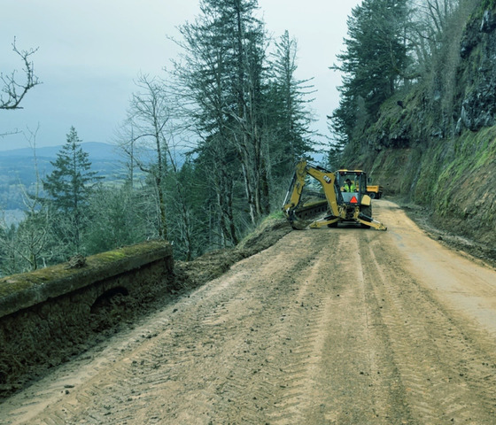 March 17 during emergency repair to the travel lanes shows a missing section of the historic rock wall at Larch Mountain.
