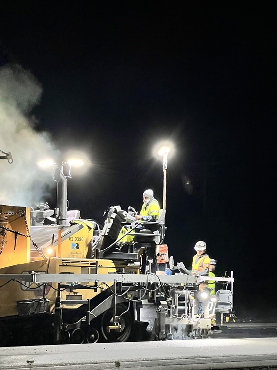 Image of crews doing night paving from a paving project done in 2025. 
