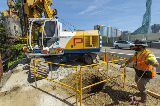 Rose Quarter Project construction crew drill a hole for the new I-5 sign structure by the Oregon Convention Center south of the Moda Center. 