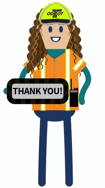 Construction worker holding thank you sign