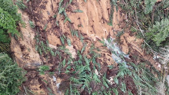 OR 229 landslide photo showing pooling water and massive amount of debris. 