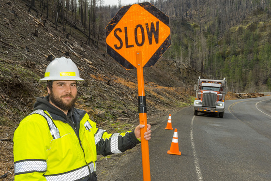 Slow down, watch for crews and equipment and follow directions from flaggers through the work zone.