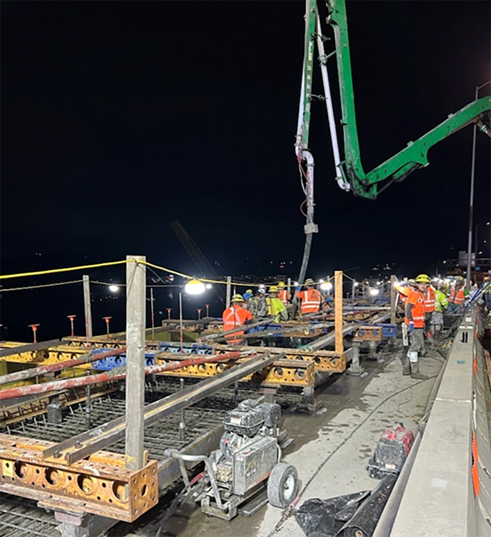 Crews pour concrete on the Abernethy Bridge on southbound Interstate 205 overnight Saturday, Aug. 22.