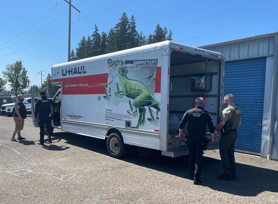 U-Haul truck with driver and local law enforcement