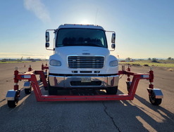 Picture of Skid Truck with sun shining from behind